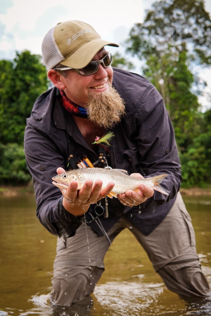 Charter Fishing Image of Chris Holding a Fish